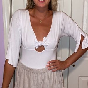 Soft White quarter sleeve body suit